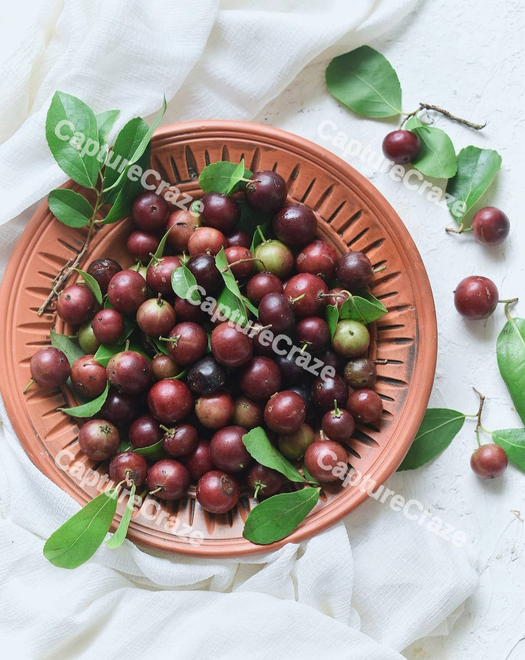 Flacourtia Rukam on a bowl